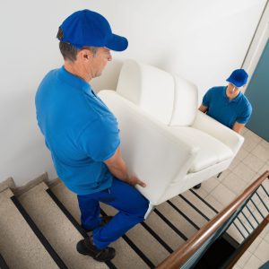 bigstock-two-movers-carrying-sofa-on-st-96725138-1(2)